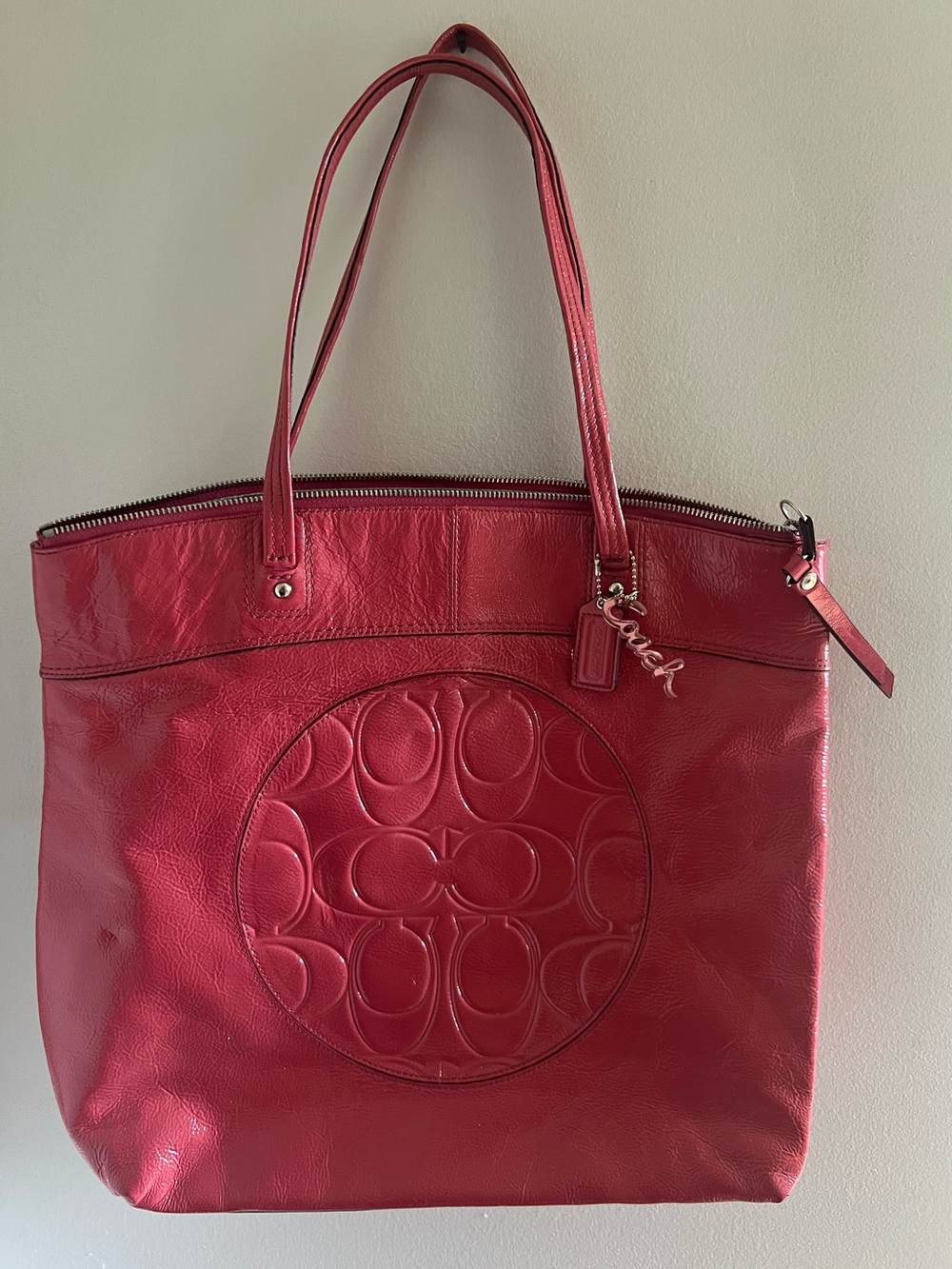 Coach Coral Patent Leather Signature Tote.